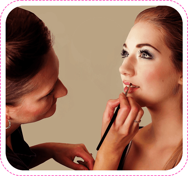 Make Up Artist Hand is Applying Lipstick With Brush to a Young Woman's Lips