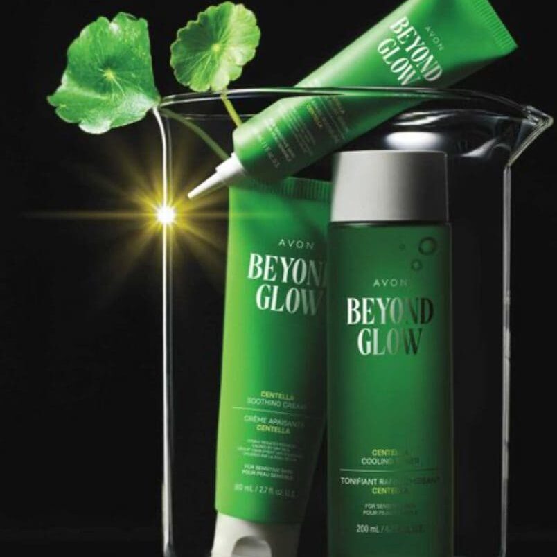 Green skincare products in a glass container.